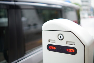 "Urban Reality" — Parking Meter Overdue and Unpaid Lights in Tokyo