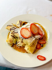 Delectable Crepe Dessert with Strawberries and Cream
