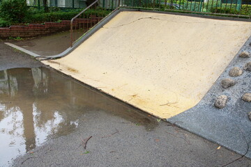 Tokyo Park: Alternative Angle of Slide and Puddle After Rain (Daily Scene)
