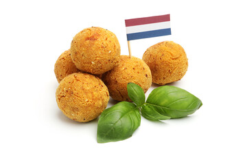 Delicious fried croquette balls, basil and small flag of Netherlands isolated on white