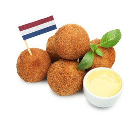 Delicious fried croquette balls, sauce, basil and small flag of Netherlands isolated on white