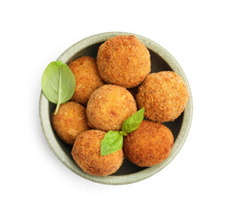 Delicious fried croquette balls with basil in bowl isolated on white, top view