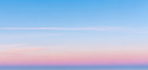 Gradient sky background featuring soft pastel tones blending blue, pink, and purple hues seamlessly, perfect for dreamy designs, web banners, or peaceful visual scenes.