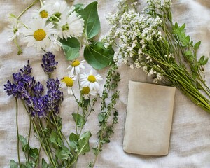 Biodegradable phone pouch organic textile eco style natural arrangement displayed on linen fabric beside wildflowers and herbs