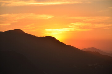 Sunset at night on Rio de Janeiro with city lights and the sea and the mountains