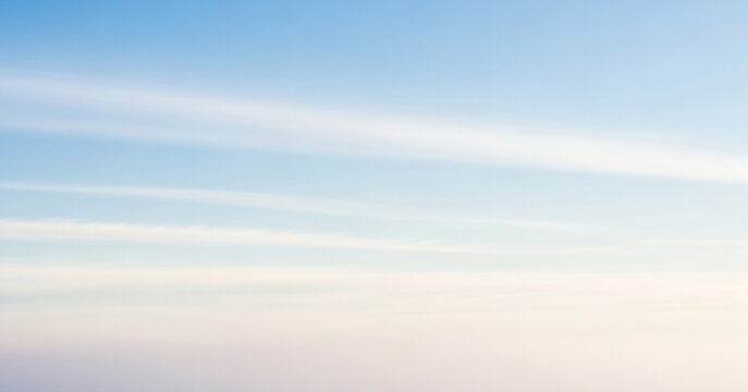 Soft pastel colors merging into a gentle gradient sky, with faint cloud formations adding subtle depth, making it perfect for abstract backgrounds or minimalist visuals.