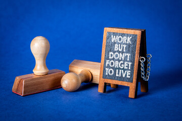 Work Life Balance Reminder Message on Chalkboard with Rubber Stamps on Blue Background