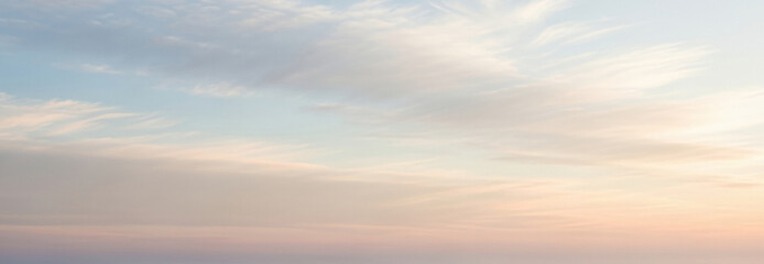 Sky filled with soft pastel tones and gentle clouds during dawn or dusk, offering a serene atmosphere that works beautifully for tranquil mockups or subtle visual layouts.