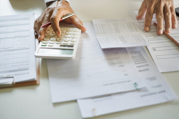 crop shot, man hand using calculator to calculate money in savings book to start new business and make investment plan