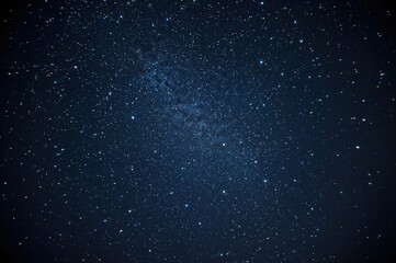Obraz premium Infinite night sky filled with glowing constellations and soft cosmic dust, creating a peaceful and magical visual experience