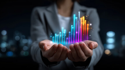 Holographic Bar Chart Display by Businesswoman in Dark Studio