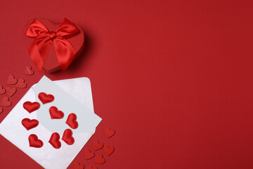 gift box and envelope with space for text on red background