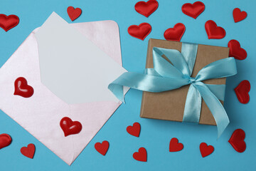 gift box and envelope with space for text on blue background