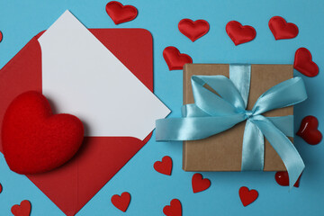 gift box and envelope with space for text on blue background
