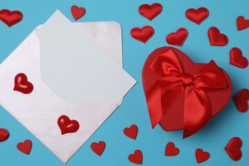 gift box and envelope with space for text on blue background