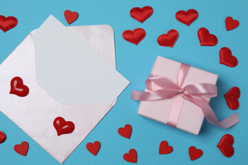 gift box and envelope with space for text on blue background