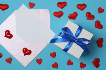 gift box and envelope with space for text on blue background