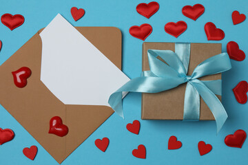 gift box and envelope with space for text on blue background