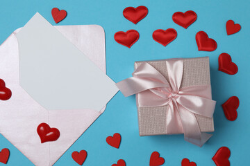 gift box and envelope with space for text on blue background
