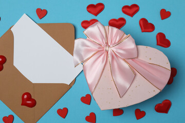 gift box and envelope with space for text on blue background