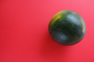Watermelon on red background.