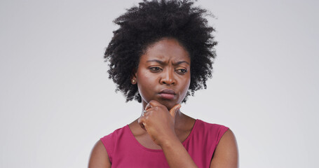 Confused, doubt and woman with thinking in studio for decision, planning and solution to question....