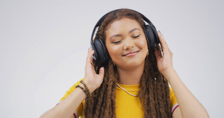 Happy, girl and headphones with music in studio for streaming subscription, radio or playlist....