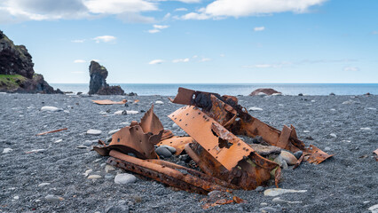 Rusty remains of a shipwreck lie scattered on Djupalonssandur beach, Snaefellsjokull National Park, Iceland.