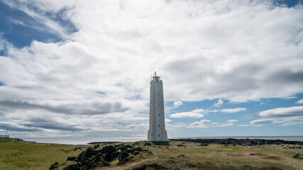 Malarrif Lighthouse on Iceland's scenic Snaefellsnes Peninsula, surrounded by volcanic coastline, ocean views