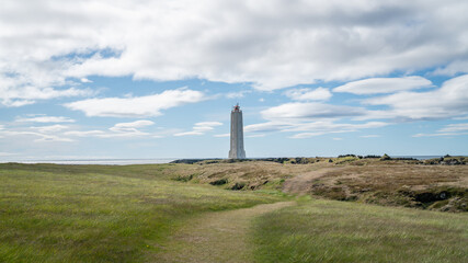 Malarrif Lighthouse on Iceland's scenic Snaefellsnes Peninsula, surrounded by volcanic coastline, ocean views