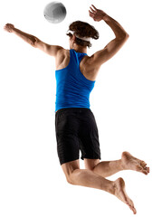 Male volleyball player jumps with determination for hit in blue shirt isolated on transparent...