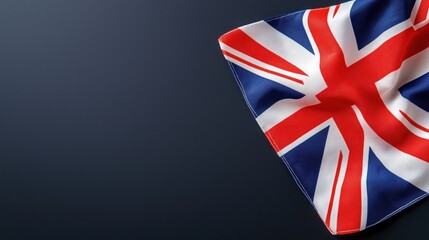 British flag draped on dark surface with text space for messaging or branding purposes