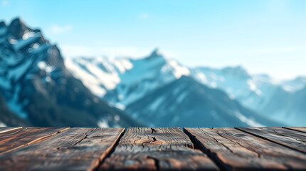 Empty wooden table with snowy mountain background providing copy space