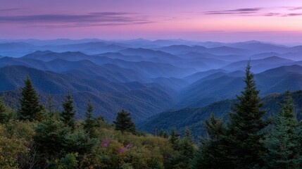Obraz premium Majestic mountain layers bathed in soft purple and blue twilight hues