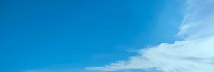 The sky was dark blue with white clouds covering almost half of the landscape. There were no people...