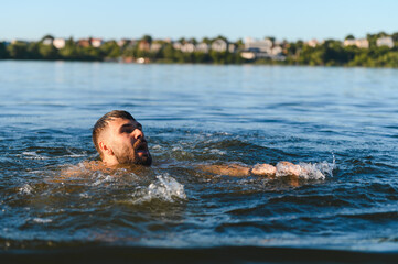 Man drowning in a lake during summer vacation