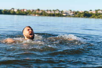 Man drowning in a lake is screaming for help
