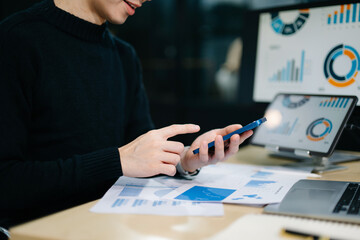 Businesswoman hand working digital marketing media in virtual screen with mobile phone and modern...