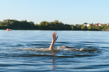 Man drowning in river raising hand asking for help
