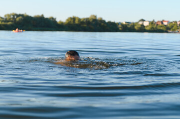 Man drowning in a lake during summer vacation