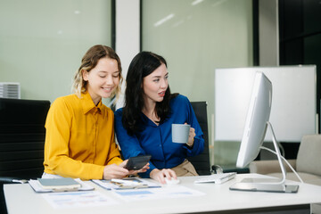 Two businesswoman and man discuss investment project working and planning strategy with tablet