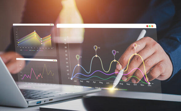 Business analysis. Businessman working on laptop computer analyzing finance sales data and economic growth graph chart and financial report, business and technology concept