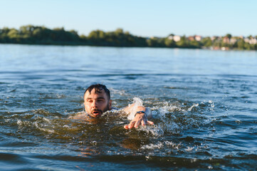 Man drowning in a lake during summer vacation