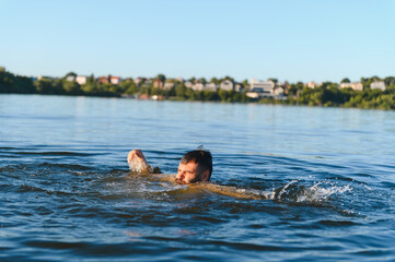 Man drowning in a lake during summer vacation