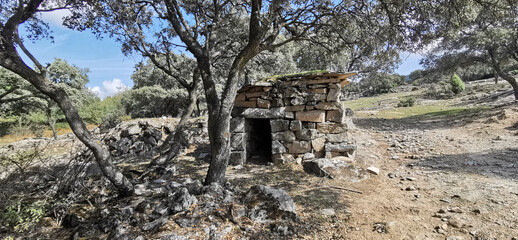 old stone hut shepherd's shelter in ruins