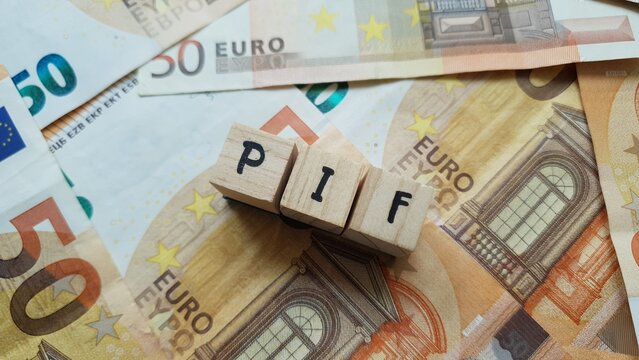 PIF acronym made of wooden letter cubes on pile of Euro banknotes. Piano di Investimento Fondi (Investment Fund Plan)