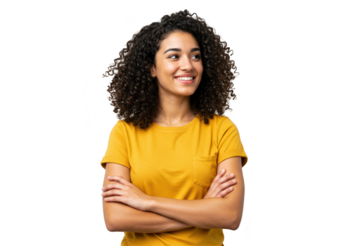 A confident young woman with curly hair smiles and looks away with crossed arms, isolated on transparent background