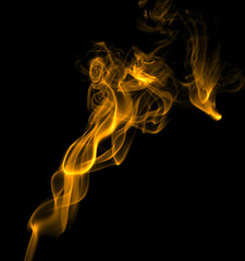 Glitter gold smoke on a black background. storm particles of dirt flying, fine sand cloud, abstract. texture of the wind of smoke powder in the desert, causing a wave of brown dust to blow
