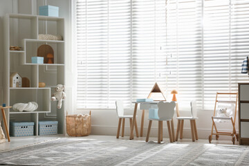 Stylish playroom with decor and furniture. Interior design