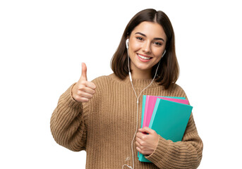 Naklejka premium A young woman student with earphones gives a thumbs up while holding books, smiling happily, isolated on a transparent background